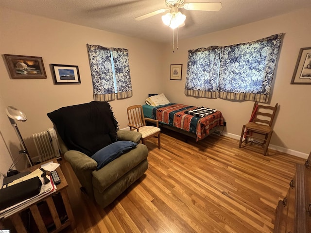 10 Dickens Ln, Taylors, SC 29687 - bedroom with light wood finished floors, ceiling fan, baseboards, and a textured ceiling