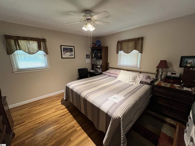 10 Dickens Ln, Taylors, SC 29687 - bedroom featuring wood finished floors, baseboards, and a ceiling fan