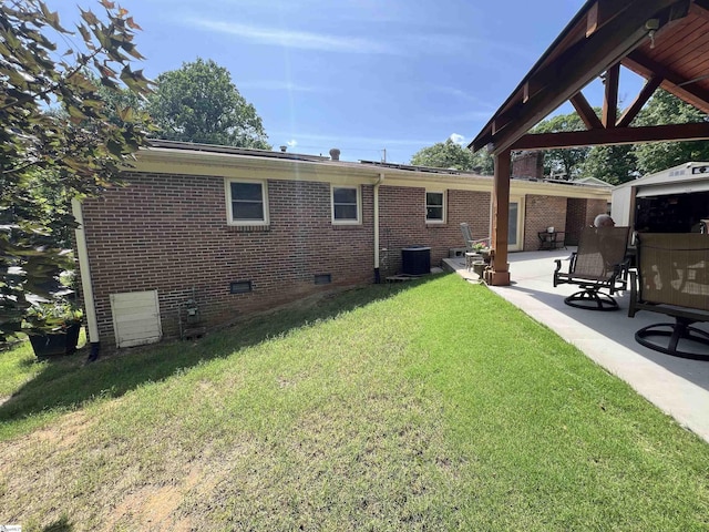 10 Dickens Ln, Taylors, SC 29687 - rear view of house featuring crawl space, central AC unit, a yard, a patio, and brick siding