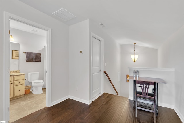 708 Emerald Hill Ct, Simpsonville, SC 29681 - hallway with an upstairs landing, wood finished floors, baseboards, and vaulted ceiling