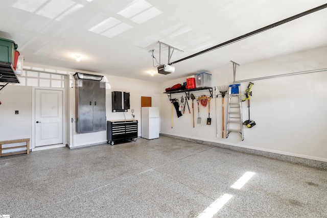 708 Emerald Hill Ct, Simpsonville, SC 29681 - garage with freestanding refrigerator, baseboards, and a garage door opener