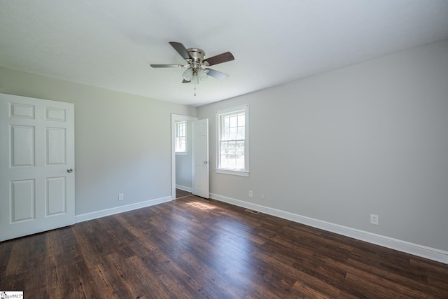 474 Lindsey Lake Rd, Travelers Rest, SC 29690 - spare room with a ceiling fan, baseboards, and dark wood-type flooring