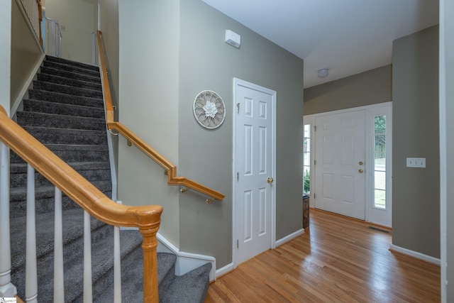 104 White Bark Way, Taylors, SC 29687 - entryway with wood finished floors, baseboards, and stairway