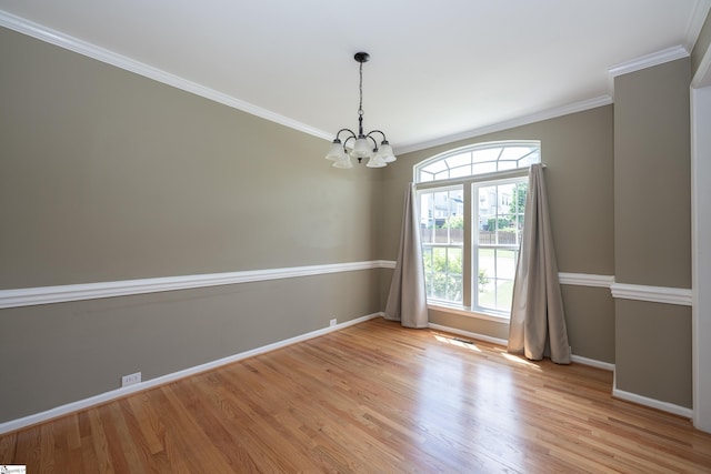 104 White Bark Way, Taylors, SC 29687 - unfurnished room featuring baseboards, light wood-style flooring, a chandelier, and ornamental molding