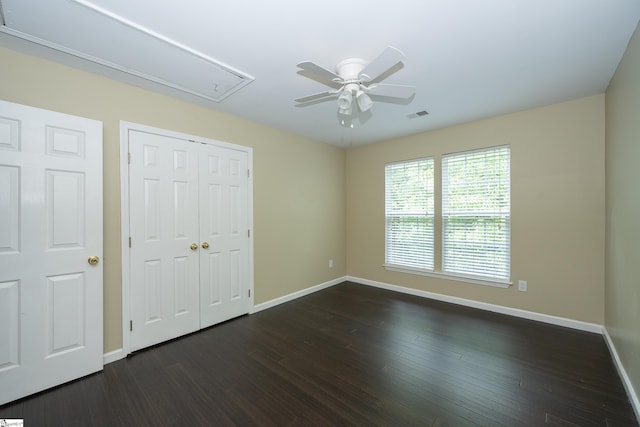 104 White Bark Way, Taylors, SC 29687 - unfurnished bedroom with attic access, baseboards, dark wood-type flooring, and a closet