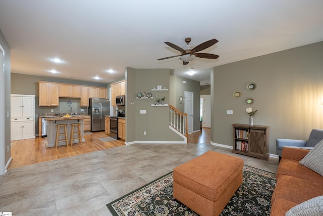 104 White Bark Way, Taylors, SC 29687 - living room featuring ceiling fan, light tile patterned floors, baseboards, and stairs