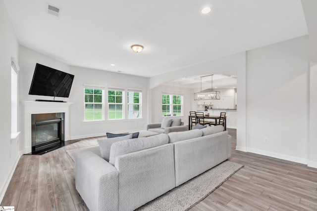153 Coppermine Dr, Easley, SC 29642 - living area with light wood-style floors, arched walkways, baseboards, and recessed lighting