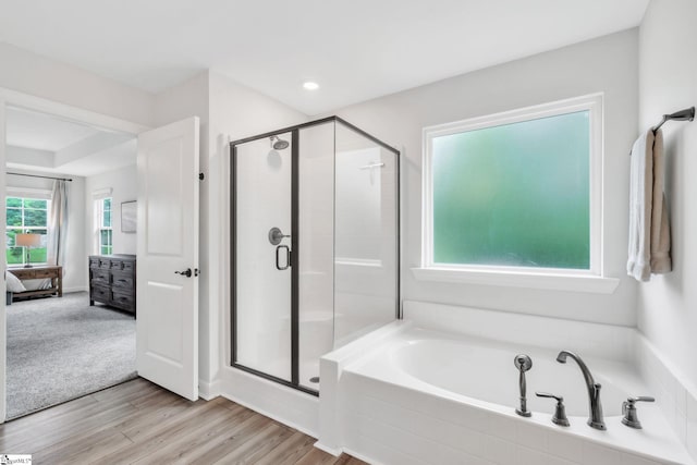 153 Coppermine Dr, Easley, SC 29642 - ensuite bathroom with a stall shower, wood finished floors, a garden tub, and recessed lighting