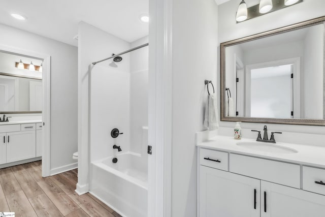 153 Coppermine Dr, Easley, SC 29642 - full bath featuring two vanities, toilet, shower / tub combination, wood finished floors, and baseboards