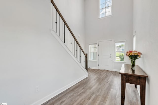 153 Coppermine Dr, Easley, SC 29642 - entrance foyer featuring stairway, a high ceiling, healthy amount of natural light, baseboards, and light wood-style flooring