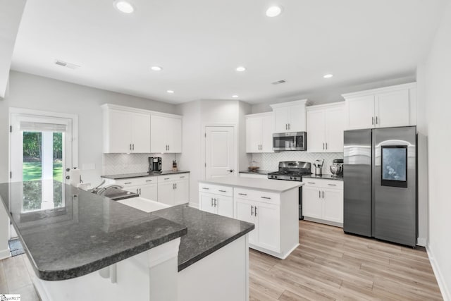 153 Coppermine Dr, Easley, SC 29642 - kitchen with stainless steel appliances, a spacious island, white cabinetry, and recessed lighting
