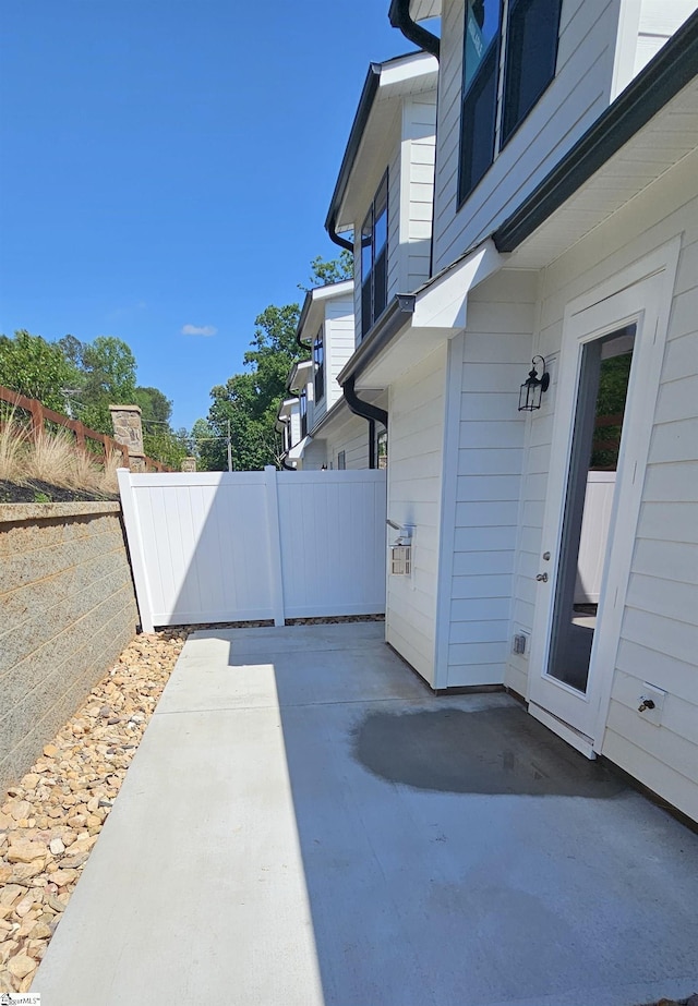 view of patio / terrace featuring fence