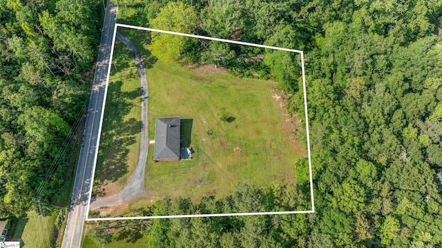 aerial view of property and surrounding area with property boundaries highlighted