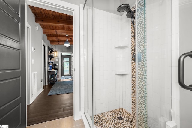653 R B Baker Dr, Chapin, SC 29036 - bathroom featuring a stall shower, wood ceiling, beam ceiling, and wood finished floors