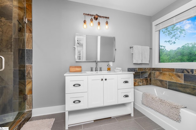 653 R B Baker Dr, Chapin, SC 29036 - bathroom with a stall shower, a garden tub, vanity, and tile patterned floors