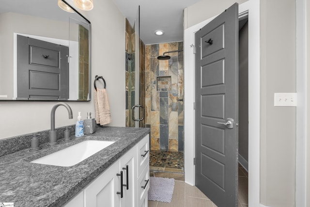 653 R B Baker Dr, Chapin, SC 29036 - bathroom featuring a shower stall, vanity, recessed lighting, and tile patterned flooring