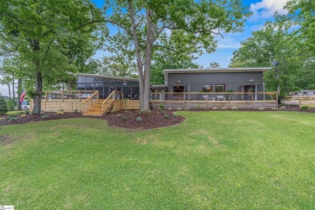 653 R B Baker Dr, Chapin, SC 29036 - view of green lawn with a sunroom, stairway, and a wooden deck