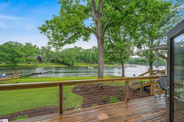 653 R B Baker Dr, Chapin, SC 29036 - wooden deck with a water view, a lawn, and view of scattered trees