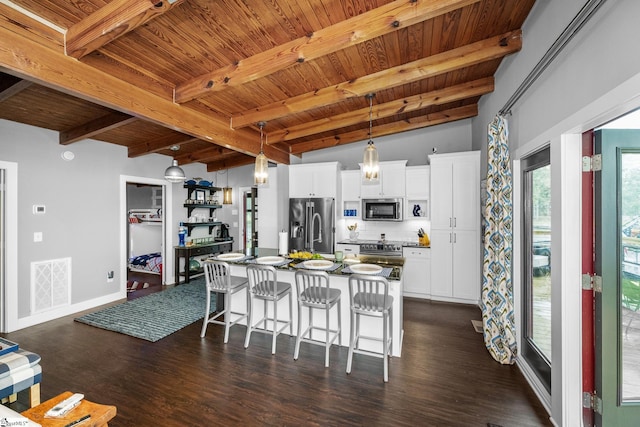 653 R B Baker Dr, Chapin, SC 29036 - kitchen featuring stainless steel appliances, wood ceiling, beam ceiling, a kitchen breakfast bar, and dark wood-style floors
