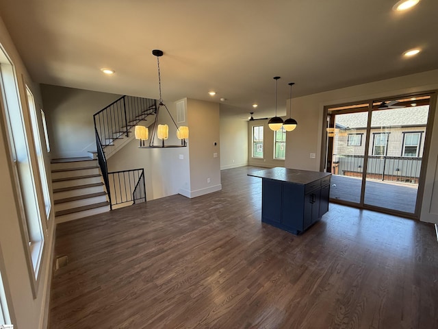 706 Anderson Rd Lot 4, Greenville, SC 29601 - kitchen featuring dark wood finished floors, dark countertops, baseboards, open floor plan, and a kitchen island