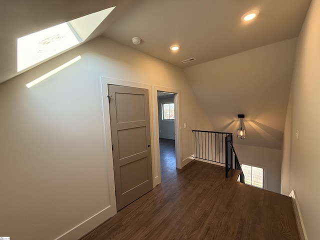706 Anderson Rd Lot 4, Greenville, SC 29601 - hall featuring an upstairs landing, lofted ceiling, a skylight, dark wood finished floors, and baseboards
