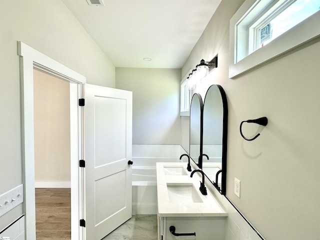 bathroom featuring double vanity