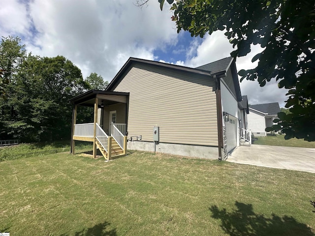 view of home's exterior with a yard and a porch