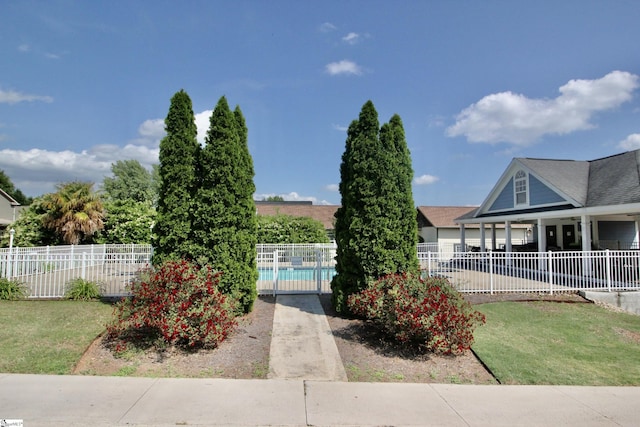 view of yard featuring a community pool