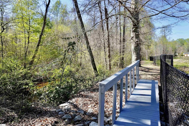 surrounding community featuring a view of trees