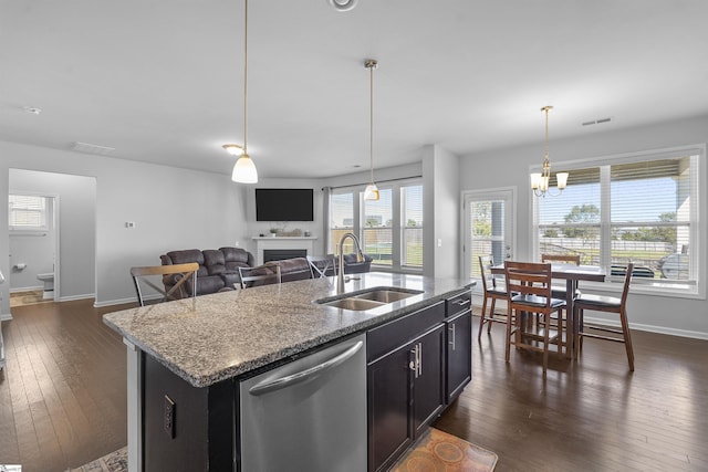 605 Mosque Ln, Lyman, SC 29365 - kitchen featuring stainless steel dishwasher, a sink, baseboards, a fireplace, and dark wood-style floors