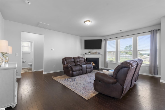 605 Mosque Ln, Lyman, SC 29365 - living room with dark wood-style floors, a fireplace with flush hearth, and baseboards