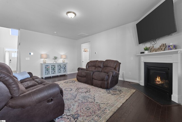 605 Mosque Ln, Lyman, SC 29365 - living area with dark wood finished floors, a glass covered fireplace, and baseboards