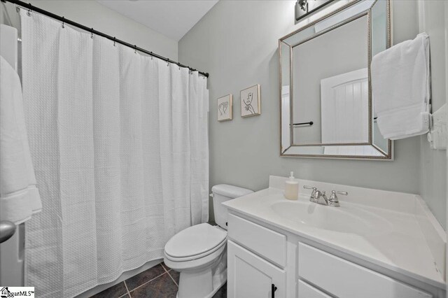 6 Kelvyn St, Greer, SC 29651 - full bathroom featuring toilet, vanity, tile patterned flooring, and curtained shower