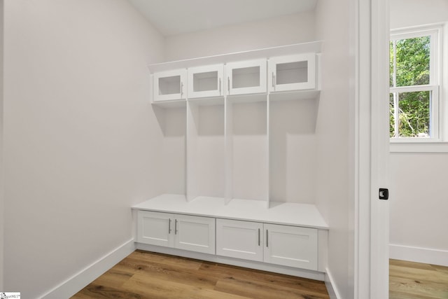 mudroom with baseboards and light wood-style floors