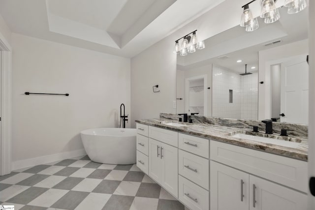 full bathroom with a tile shower, a soaking tub, baseboards, double vanity, and tile patterned floors