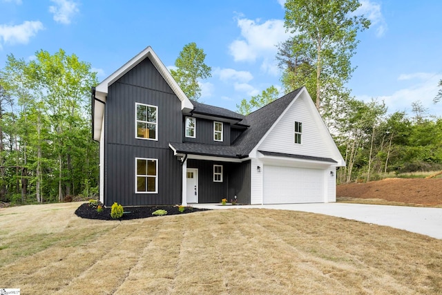 modern farmhouse style home with concrete driveway, an attached garage, a front yard, and a shingled roof