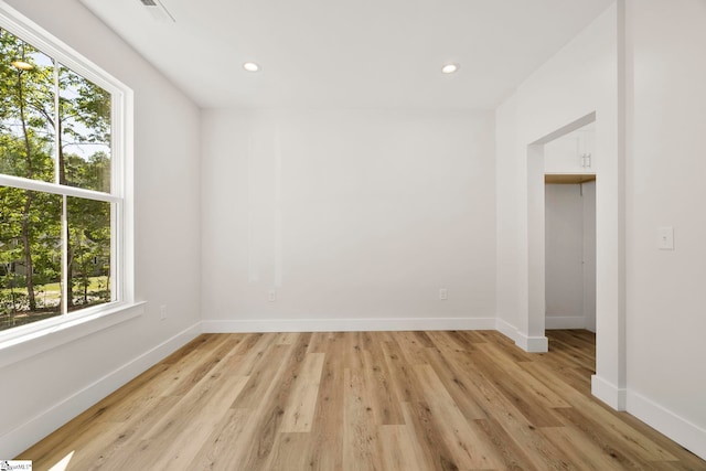 unfurnished bedroom with baseboards, light wood-style flooring, and recessed lighting