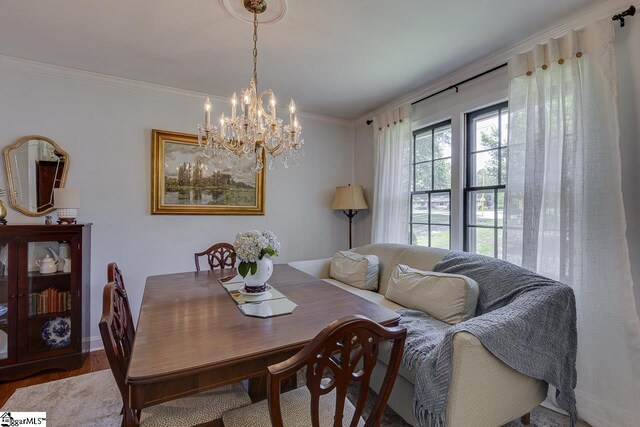 202 Roberta Dr, Greenville, SC 29615 - dining space featuring wood finished floors, crown molding, and a chandelier