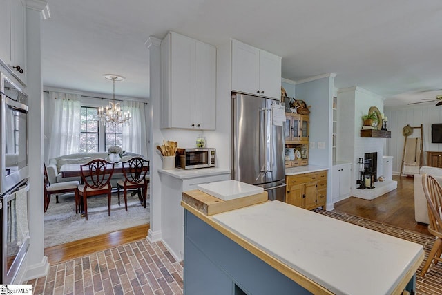 202 Roberta Dr, Greenville, SC 29615 - kitchen featuring stainless steel appliances, baseboards, open floor plan, light countertops, and ornamental molding