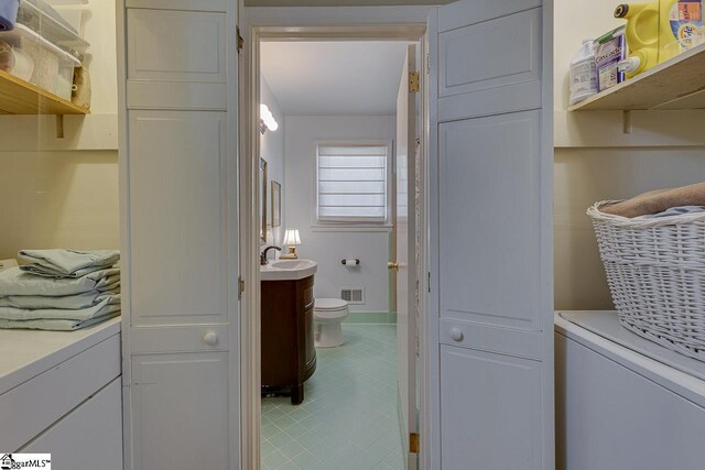 202 Roberta Dr, Greenville, SC 29615 - clothes washing area with light tile patterned flooring and a sink