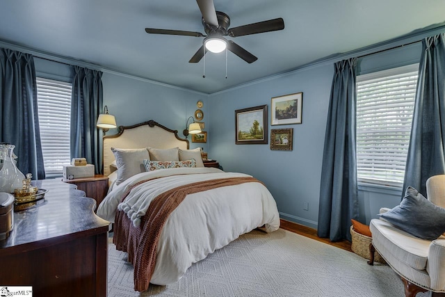202 Roberta Dr, Greenville, SC 29615 - bedroom with multiple windows, crown molding, wood finished floors, baseboards, and ceiling fan