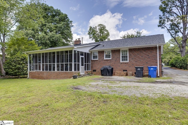 202 Roberta Dr, Greenville, SC 29615 - rear view of house with a sunroom, brick siding, a chimney, a lawn, and crawl space