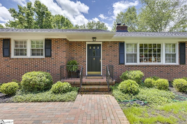 202 Roberta Dr, Greenville, SC 29615 - view of exterior entry featuring a chimney and brick siding