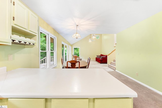 251 Cherokee Dr, Fair Play, SC 29643 - kitchen featuring light carpet, light countertops, baseboards, hanging light fixtures, and white cabinetry