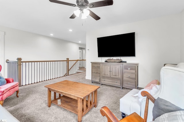 living area with ceiling fan, light carpet, and recessed lighting