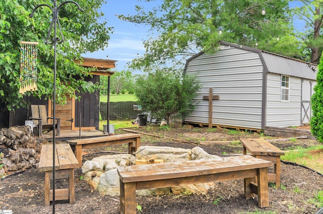 view of yard with a shed and an outbuilding