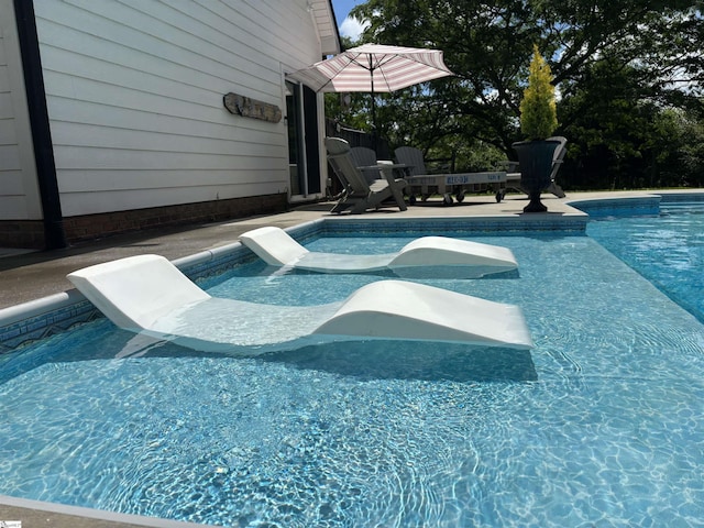 swimming pool with a patio