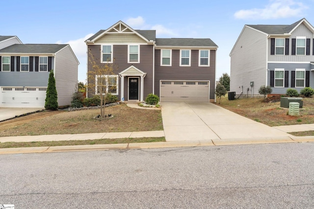 625 Mccormick Ln, Lyman, SC 29365 - view of front of house with concrete driveway, a garage, and central AC