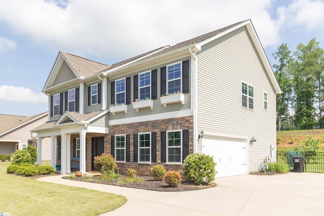 110 Avendell Dr, Easley, SC 29642 - view of front of home with concrete driveway, roof with shingles, an attached garage, and stone siding
