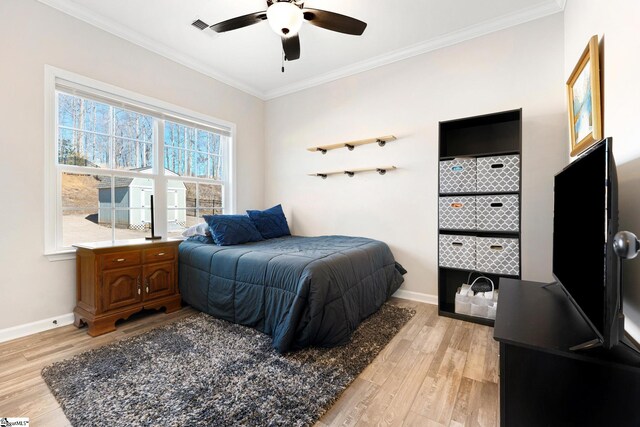 110 Avendell Dr, Easley, SC 29642 - bedroom with light wood-type flooring, ornamental molding, baseboards, and ceiling fan